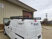Custom metal roof rack fabrication for a work vehicle.