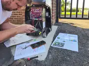 Wide driveway gate installation with welded frame details.
