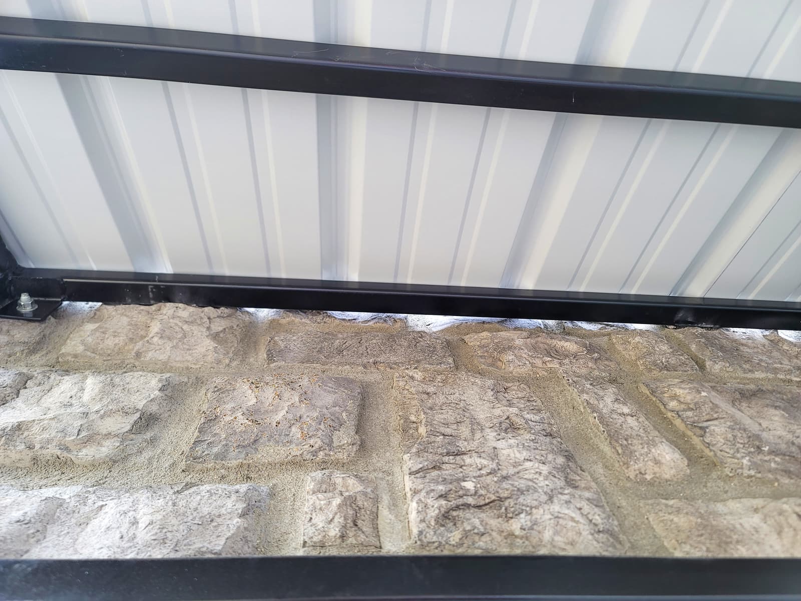 Custom metal awning frame fabrication with welded supports.