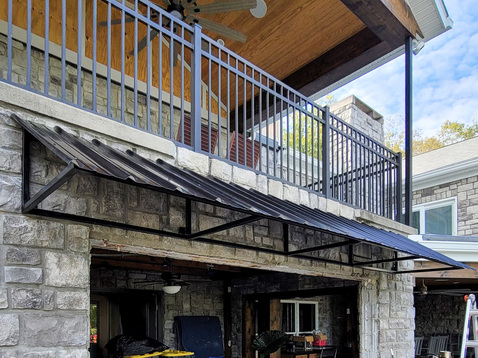 Welded steel awning brackets and architectural support frame.