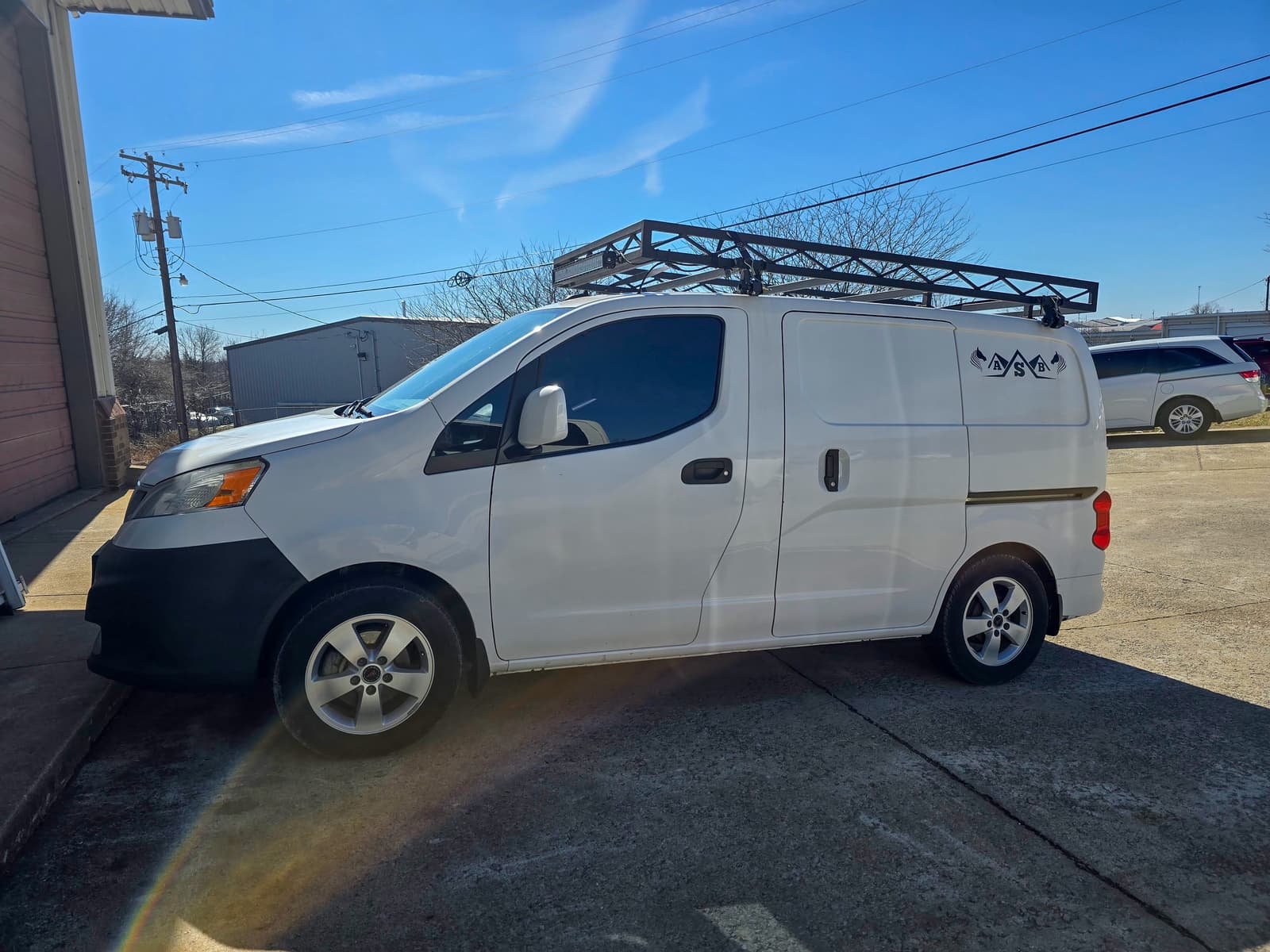 Finished custom metal roof-rack project ready for work use.