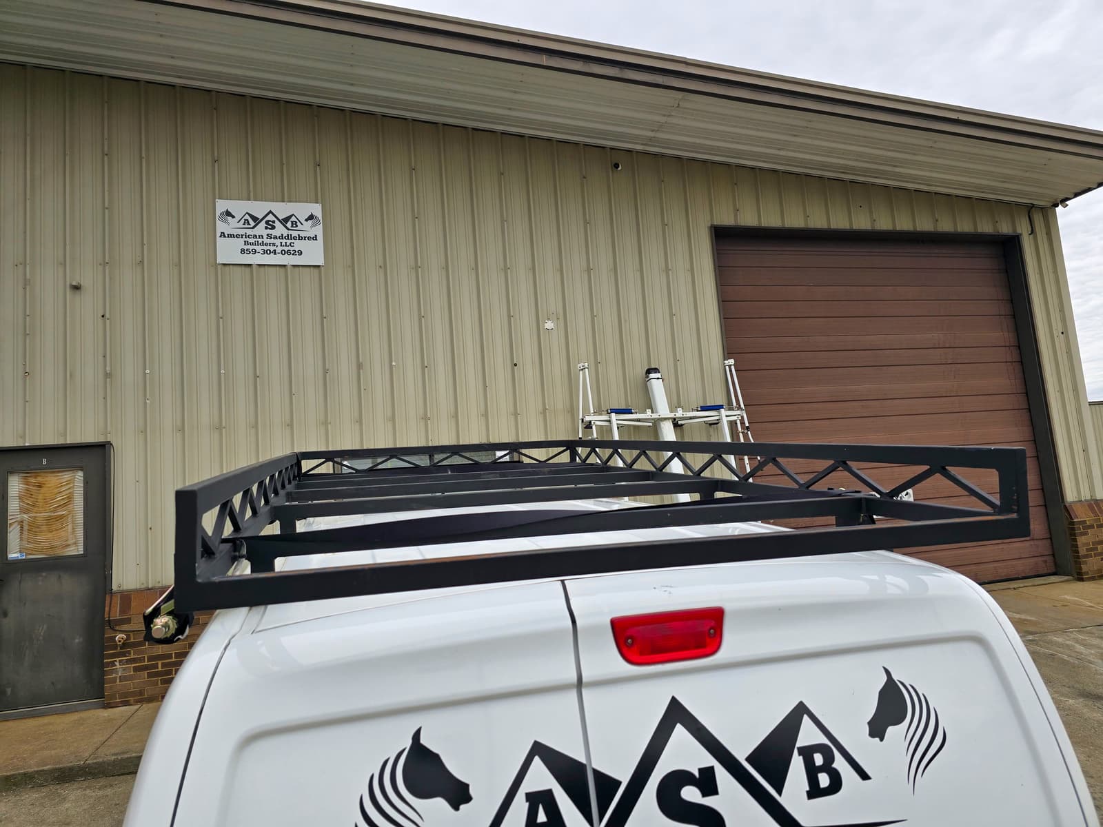 Custom roof-rack mounting and clearance details on a work vehicle.