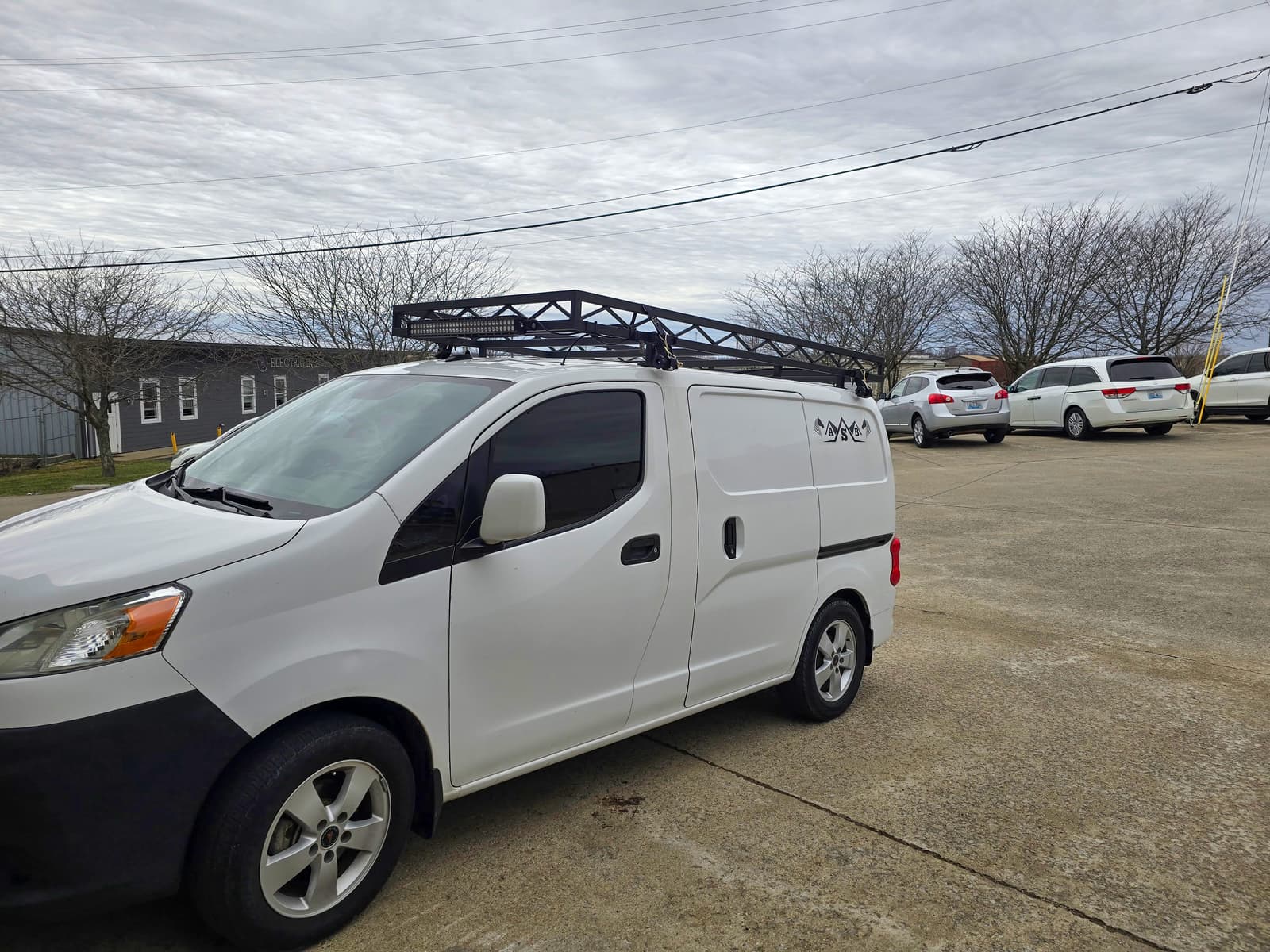 Fabricated steel vehicle rack with welded supports and crossmembers.