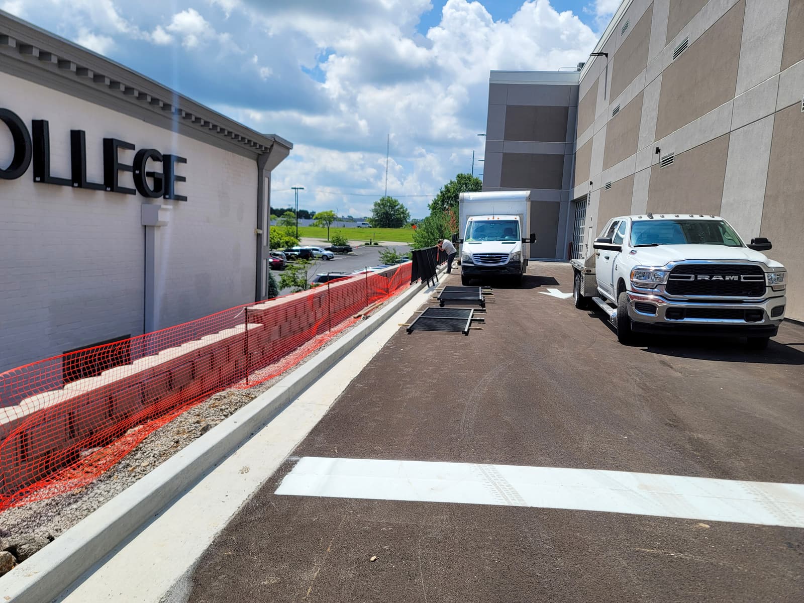 Perimeter metal railing protecting a commercial walkway.