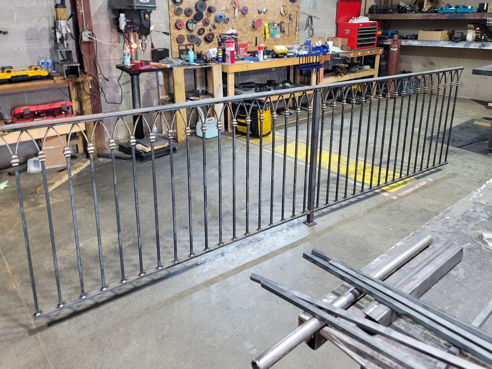 Ornamental commercial metal railing with black finish.